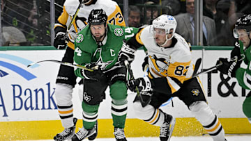 Mar 23, 2023; Dallas, Texas, USA; Dallas Stars left wing Jamie Benn (14) and Pittsburgh Penguins center Sidney Crosby (87) chase the puck during the second period at the American Airlines Center. Mandatory Credit: Jerome Miron-Imagn Images