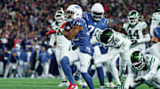 Nov 13, 2025; Foxborough, Massachusetts, USA; New England Patriots running back TreVeyon Henderson (32) celebrates after scoring a touchdown during the second half against the New York Jets at Gillette Stadium. Mandatory Credit: David Butler II-Imagn Images
