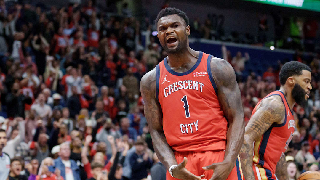 Nov 26, 2025; New Orleans, Louisiana, USA;  New Orleans Pelicans forward Zion Williamson (1) reacts after a basket against Memphis Grizzlies forward Jaren Jackson Jr. (8) during the second half at Smoothie King Center. Mandatory Credit: Matthew Hinton-Imagn Images