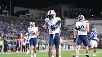 Nov 15, 2025; Durham, North Carolina, USA;  Virginia Cavaliers wide receiver Trell Harris (11) celebrates a touchdown against the Duke Blue Devils in the third quarter at Wallace Wade Stadium. Mandatory Credit: Zachary Taft-Imagn Images