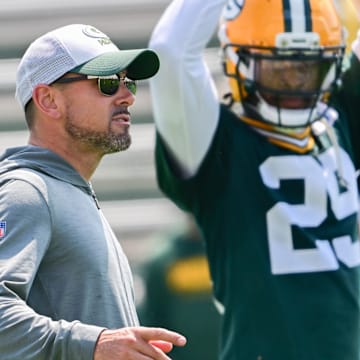 Green Bay Packers coach Matt LaFleur watches minicamp alonside Xavier McKinney at Ray Nitschke Field. 
