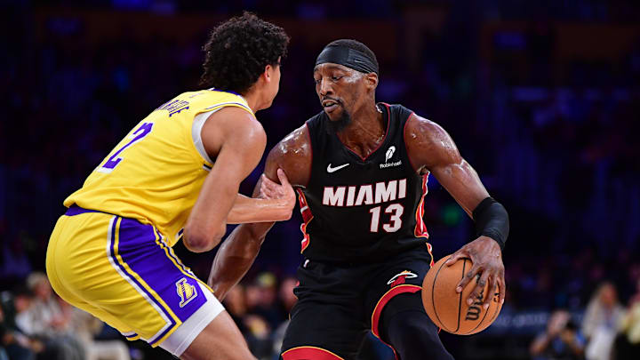 January 15, 2025; Los Angeles, California, USA; Miami Heat center Bam Adebayo (13) moves the ball against Los Angeles Lakers guard Max Christie (12) during the first half at Crypto.com Arena. Mandatory Credit: Gary A. Vasquez-Imagn Images