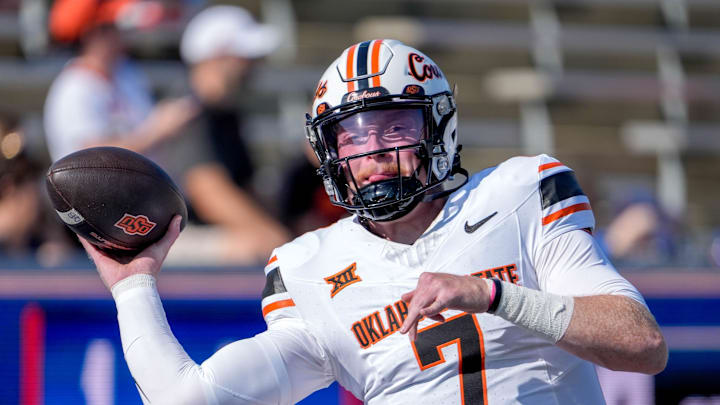 Oklahoma State quarterback Alan Bowman (7) warms up before an NCAA football game between Oklahoma State and Tulsa in Tulsa, Okla., on Saturday, Sept. 14, 2024.