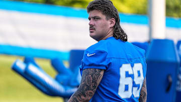 Detroit Lions guard Tate Ratledge (69) walks onto the field for practice during training camp at Meijer Performance Center in Allen Park on Monday, July 21, 2025.