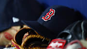 Sep 20, 2019; St. Petersburg, FL, USA; A detail view of Boston Red Sox hats and gloves at Tropicana Field. Mandatory Credit: Kim Klement-Imagn Images