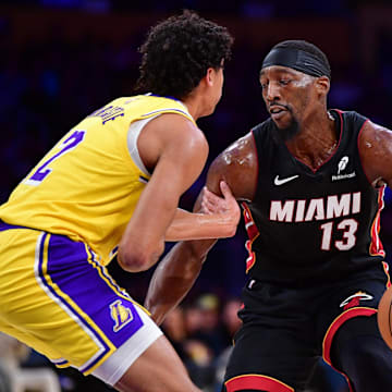 January 15, 2025; Los Angeles, California, USA; Miami Heat center Bam Adebayo (13) moves the ball against Los Angeles Lakers guard Max Christie (12) during the first half at Crypto.com Arena. Mandatory Credit: Gary A. Vasquez-Imagn Images