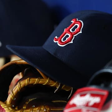 Sep 20, 2019; St. Petersburg, FL, USA; A detail view of Boston Red Sox hats and gloves at Tropicana Field. Mandatory Credit: Kim Klement-Imagn Images