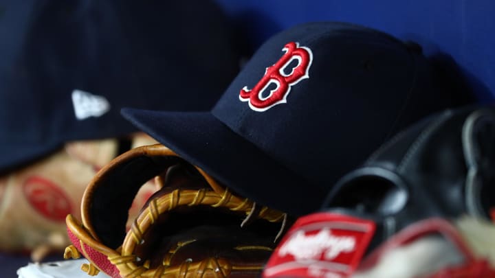 Sep 20, 2019; St. Petersburg, FL, USA; A detail view of Boston Red Sox hats and gloves at Tropicana Field. Mandatory Credit: Kim Klement-USA TODAY Sports