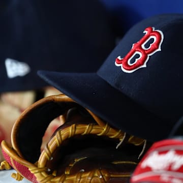 Sep 20, 2019; St. Petersburg, FL, USA; A detail view of Boston Red Sox hats and gloves at Tropicana Field. Mandatory Credit: Kim Klement-Imagn Images