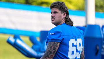 Detroit Lions guard Tate Ratledge (69) walks onto the field for practice during training camp at Meijer Performance Center in Allen Park on Monday, July 21, 2025.