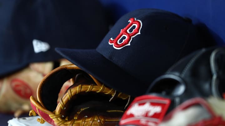 Sep 20, 2019; St. Petersburg, FL, USA; A detail view of Boston Red Sox hats and gloves at Tropicana Field. Mandatory Credit: Kim Klement-Imagn Images