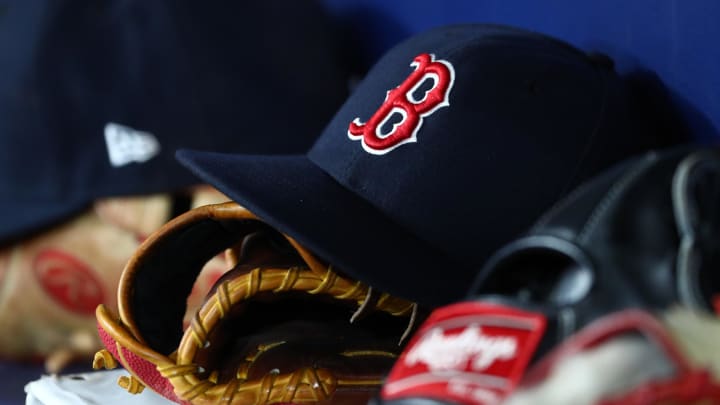 Sep 20, 2019; St. Petersburg, FL, USA; A detail view of Boston Red Sox hats and gloves at Tropicana Field. Mandatory Credit: Kim Klement-USA TODAY Sports