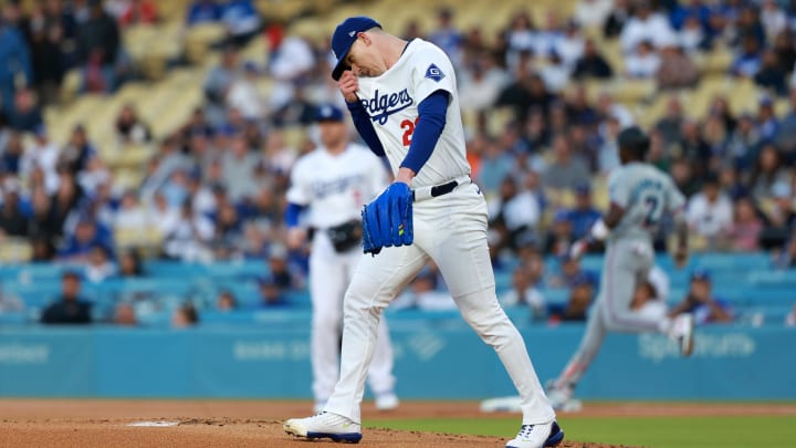 May 6, 2024; Los Angeles, California, USA;  Los Angeles Dodgers starting pitcher Walker Buehler (21) reacts after giving up a hit to Miami Marlins outfielder Jazz Chisholm Jr. (2) during the first inning at Dodger Stadium. Mandatory Credit: Kiyoshi Mio-USA TODAY Sports