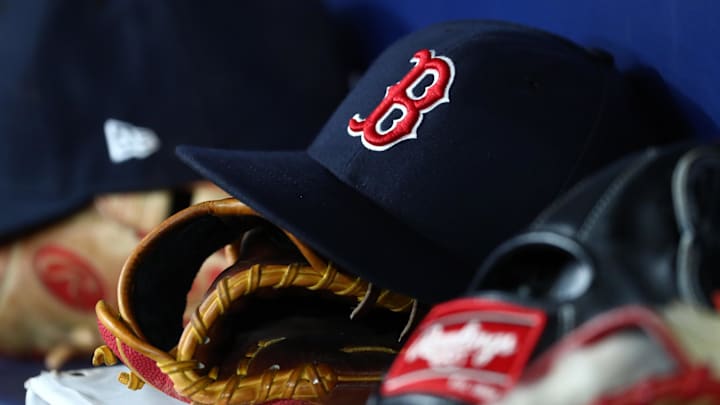 Sep 20, 2019; St. Petersburg, FL, USA; A detail view of Boston Red Sox hats and gloves at Tropicana Field. Mandatory Credit: Kim Klement-Imagn Images