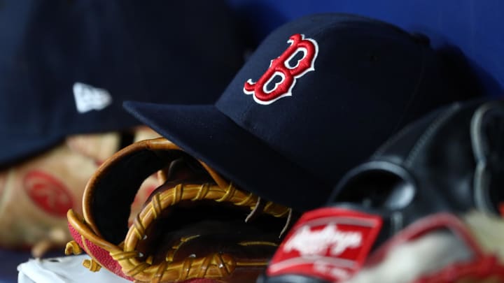 sep 20, 2019; st. petersburg, fl, usa; a detail view of boston red sox hats and gloves at tropicana field. mandatory credit: kim klement-usa today sports