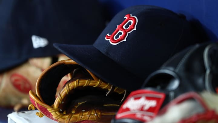 Sep 20, 2019; St. Petersburg, FL, USA; A detail view of Boston Red Sox hats and gloves at Tropicana Field. Mandatory Credit: Kim Klement-Imagn Images