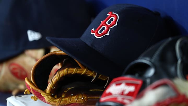 Sep 20, 2019; St. Petersburg, FL, USA; A detail view of Boston Red Sox hats and gloves at Tropicana Field. Mandatory Credit: Kim Klement-Imagn Images