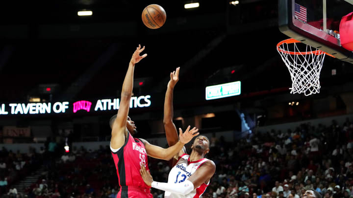 Jul 14, 2024; Las Vegas, NV, USA; Houston Rockets center Orlando Robinson (59) shoots against Washington Wizards forward Alex Sarr (12) during the fourth quarter at Thomas & Mack Center. Mandatory Credit: Stephen R. Sylvanie-USA TODAY Sports