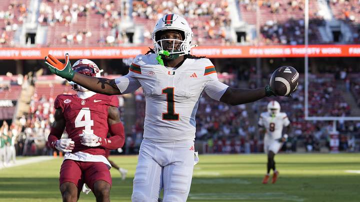 Sep 4, 2026; Stanford, California, USA;  Miami Hurricanes wide receiver Malachi Toney (1) reacts after scoring a touchdown against the Stanford Cardinal during the first quarter at Stanford Stadium.  Mandatory Credit: Stan Szeto-Imagn Images