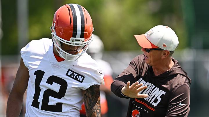 Cleveland Browns head coach Todd Monken talks to wide receiver Denzel Boston
