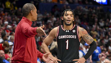 Mar 12, 2025; Nashville, TN, USA;  South Carolina Gamecocks head coach Lamont Paris talks with guard Jacobi Wright (1) during a break in action during the second half at Bridgestone Arena. Mandatory Credit: Steve Roberts-Imagn Images