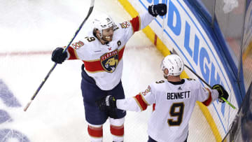 May 30, 2024; New York, New York, USA; Florida Panthers center Sam Bennett (9) celebrates his empty net goal against the New York Rangers with left wing Matthew Tkachuk (19) during the third period of game five of the Eastern Conference Final of the 2024 Stanley Cup Playoffs at Madison Square Garden. Mandatory Credit: Brad Penner-USA TODAY Sports