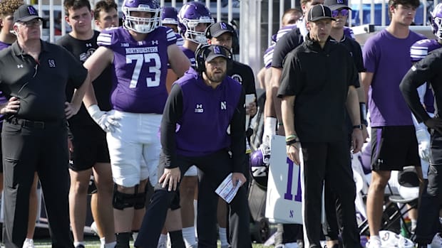 Northwestern Wildcats head coach David Braun watches the game against the UCLA Bruins.