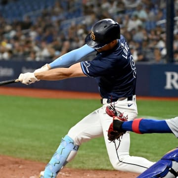 Jun 11, 2024; St. Petersburg, Florida, USA; Tampa Bay Rays designated hitter Brandon Lowe (8) hits a three run game winning home run in the ninth inning against the Chicago Cubs at Tropicana Field.