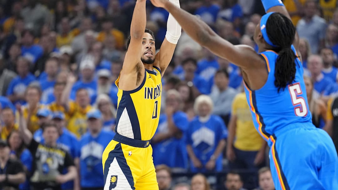 Jun 22, 2025; Oklahoma City, Oklahoma, USA; Indiana Pacers guard Tyrese Haliburton (0) shoots the ball against Oklahoma City Thunder guard Luguentz Dort (5) during the first half of game seven of the 2025 NBA Finals at Paycom Center. Mandatory Credit: Kyle Terada-Imagn Images