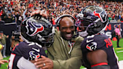 Nov 9, 2025; Houston, Texas, USA; Houston Texans head coach DeMeco Ryans with defensive tackle Sheldon Rankins (90) and linebacker Azeez Al-Shaair (0) following a game against the Jacksonville Jaguars at NRG Stadium. Mandatory Credit: Thomas Shea-Imagn Images