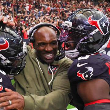 Nov 9, 2025; Houston, Texas, USA; Houston Texans head coach DeMeco Ryans with defensive tackle Sheldon Rankins (90) and linebacker Azeez Al-Shaair (0) following a game against the Jacksonville Jaguars at NRG Stadium. Mandatory Credit: Thomas Shea-Imagn Images