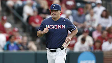 Jun 3, 2024; Norman, OK, USA; UConn head coach Jim Penders runs off the field before the start of an NCAA Division I Baseball Championship game between the UConn Huskies and the Oklahoma Sooners at L. Dale Mitchell Park. Mandatory Credit: Alonzo Adams-Imagn Images