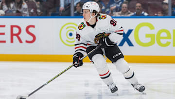 Mar 15, 2025; Vancouver, British Columbia, CAN; Chicago Blackhawks forward Connor Bedard (98) handles the puck against the Vancouver Canucks in the third period at Rogers Arena. Mandatory Credit: Bob Frid-Imagn Images