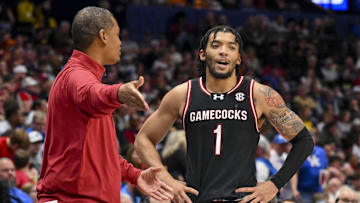Mar 12, 2025; Nashville, TN, USA;  South Carolina Gamecocks head coach Lamont Paris talks with guard Jacobi Wright (1) during a break in action during the second half at Bridgestone Arena. Mandatory Credit: Steve Roberts-Imagn Images