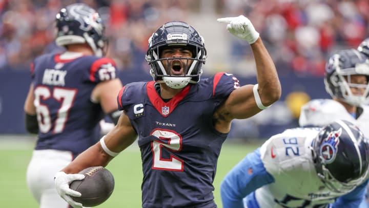 Dec 31, 2023; Houston, Texas, USA; Houston Texans wide receiver Robert Woods (2) celebrates his first down run against the Tennessee Titans in the first quarter at NRG Stadium. Mandatory Credit: Thomas Shea-USA TODAY Sports