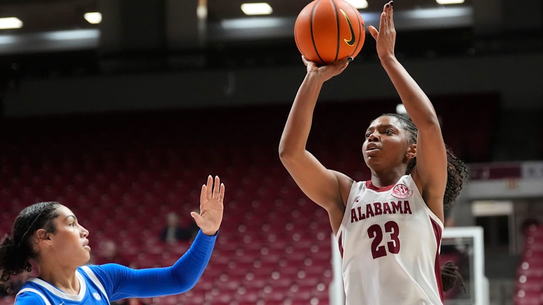 Jan 8, 2026; Tuscaloosa, AL, USA; Alabama guard Jessica Timmons (23) shoots over Kentucky guard Asia Boone (8) at Coleman Coliseum.