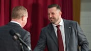 Florida State University Athletic Director Michael Alford shakes hands with FSU’s new men’s basketball coach Luke Loucks during a press conference Monday, March 10, 2025.