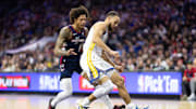 Feb 7, 2024; Philadelphia, Pennsylvania, USA; Golden State Warriors guard Stephen Curry (30) and Philadelphia 76ers guard Kelly Oubre Jr. (9) chase a loose ball during the second quarter at Wells Fargo Center. Mandatory Credit: Bill Streicher-Imagn Images