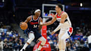 Nov 27, 2024; Washington, District of Columbia, USA; LA Clippers guard Terance Mann (14) drives to the basket against Washington Wizards forward Patrick Baldwin Jr. (7) during the third quarter at Capital One Arena. Mandatory Credit: Reggie Hildred-Imagn Images