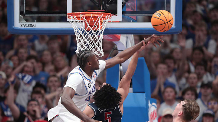 Kansas Jayhawks forward Flory Bidunga (40) blocks a shot by Arizona Wildcats guard Brayden Burries (5) during the game inside Allen Fieldhouse on Feb. 9, 2026.