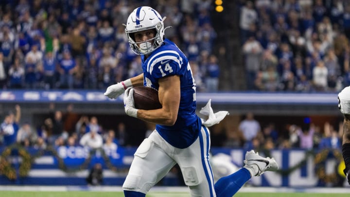 Indianapolis Colts wide receiver Alec Pierce (14) runs for a touchdown while Las Vegas Raiders cornerback Jack Jones (18) defends in the first half at Lucas Oil Stadium.