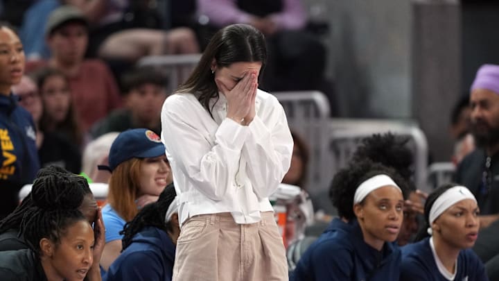 Indiana Fever guard Caitlin Clark (center) reacts during the third quarter against the Golden State Valkyries at Chase Center. 