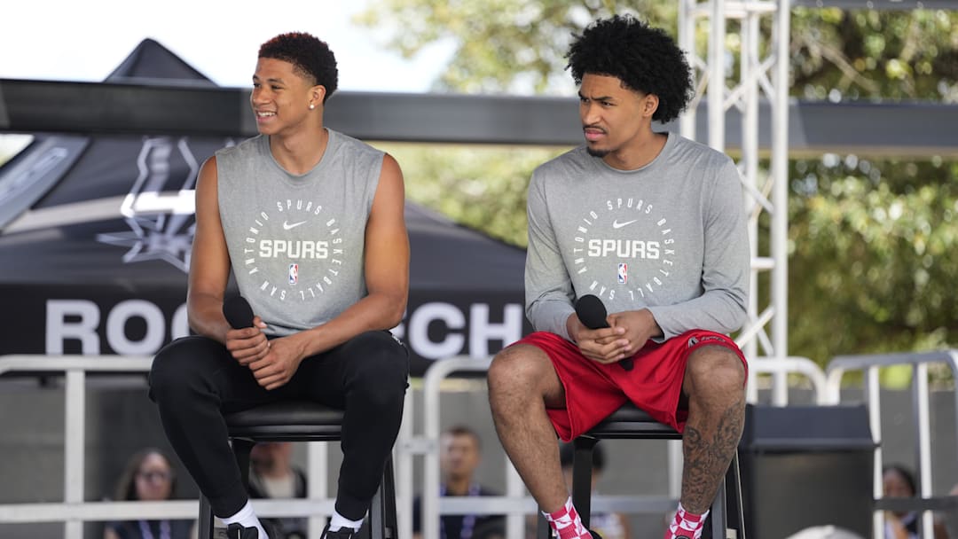 Jun 28, 2025; San Antonio, TX, USA; San Antonio first round draft picks Carter Bryant (left) and Dylan Harper answer questions during the Spurs Family Cookout at Victory Capital Performance Center. Mandatory Credit: Scott Wachter-Imagn Images