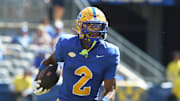 Aug 30, 2025; Pittsburgh, Pennsylvania, USA; Pittsburgh Panthers wide receiver Kenny Johnson (2) returns a punt against the Duquesne Dukes during the fourth quarter at Acrisure Stadium. Mandatory Credit: Charles LeClaire-Imagn Images