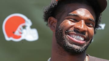 Cleveland Browns quarterback Shedeur Sanders (12) is all smiles as he reflects on his first day of practice during a press conference before day two of NFL rookie minicamp at the Cleveland Browns training facility on Saturday, May 10, 2025, in Berea, Ohio.
