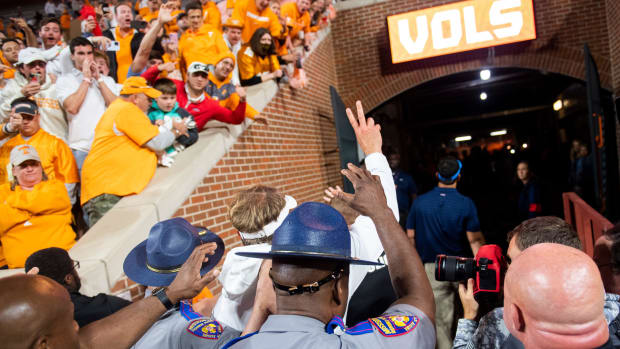 Lane Kiffin waves to fans after beating Tennessee with Ole Miss in 2021. 