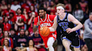 Feb 22, 2025; Tucson, Arizona, USA; BYU Cougars guard Richie Saunders (15) dribbles the ball while Arizona Wildcats guard KJ Lewis (5) follows him during the first half at McKale Center. Mandatory Credit: Aryanna Frank-Imagn Images