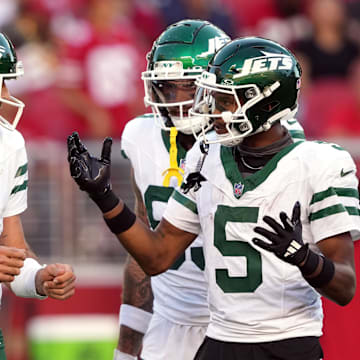 Sep 9, 2024; Santa Clara, California, USA; New York Jets quarterback Aaron Rodgers (8) and wide receiver Garrett Wilson (5) talk on the field during the second quarter against the San Francisco 49ers at Levi's Stadium. 