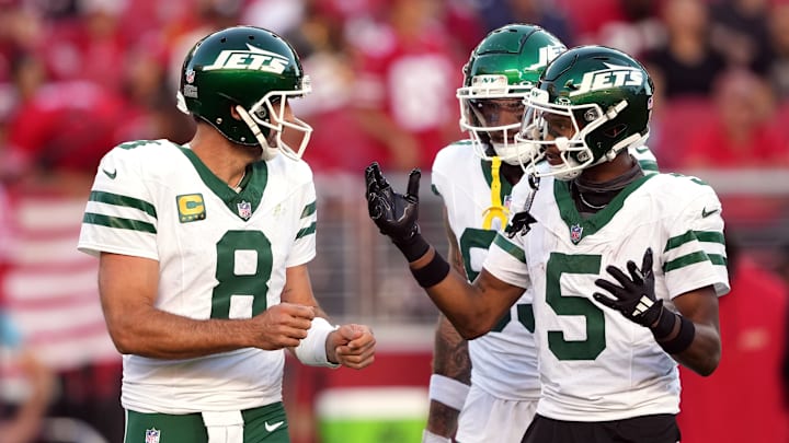 Sep 9, 2024; Santa Clara, California, USA; New York Jets quarterback Aaron Rodgers (8) and wide receiver Garrett Wilson (5) talk on the field during the second quarter against the San Francisco 49ers at Levi's Stadium. 