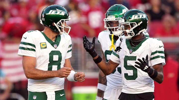 New York Jets quarterback Aaron Rodgers (8) and wide receiver Garrett Wilson.